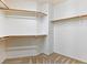 Walk-in closet featuring wooden closet rods and carpeted floor at 38 E Serene Ave # 134, Las Vegas, NV 89123