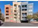 Apartment building exterior with balconies and parking at 38 E Serene Ave # 134, Las Vegas, NV 89123