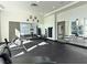 Spacious gym with a full wall mirror, free weights, and floor-to-ceiling windows at 38 E Serene Ave # 134, Las Vegas, NV 89123