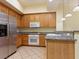 Kitchen showcasing granite countertops, stainless steel refrigerator, and ample cabinet storage at 38 E Serene Ave # 134, Las Vegas, NV 89123