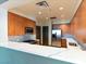 Modern kitchen featuring stainless steel appliances, wood cabinets, and a breakfast bar with quartz countertop at 38 E Serene Ave # 134, Las Vegas, NV 89123
