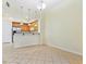 Neutral living room showing open floorplan to kitchen and tile flooring at 38 E Serene Ave # 134, Las Vegas, NV 89123