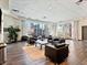 Bright community lounge area with comfortable seating, wood-look floors, and large windows at 38 E Serene Ave # 134, Las Vegas, NV 89123