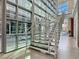 Modern staircase with cable railings and lots of natural light at Manhattan Condominiums at 38 E Serene Ave # 134, Las Vegas, NV 89123