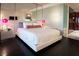 Sleek bedroom featuring a king size bed, a glass desk, and modern lighting at 4381 W Flamingo Rd # 2903, Las Vegas, NV 89103