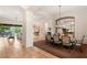 Open concept dining room with seating for eight and views to the living room at 4649 Bird View Ct, Las Vegas, NV 89129