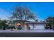 Beautiful brick home with mature landscaping and a three-car garage at 4649 Bird View Ct, Las Vegas, NV 89129