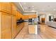 Open kitchen boasts granite counters, wood cabinets, and tile floors at 4649 Bird View Ct, Las Vegas, NV 89129