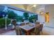 Covered patio with dining table and chairs, overlooking the pool at 4649 Bird View Ct, Las Vegas, NV 89129