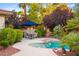 Relaxing pool area with patio furniture and landscaping at 4649 Bird View Ct, Las Vegas, NV 89129