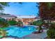 Stunning pool and patio area with lush landscaping and lighting at 4649 Bird View Ct, Las Vegas, NV 89129