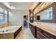 Luxurious bathroom with soaking tub, walk-in shower, and double vanity at 4750 Fiore Bella Blvd, Las Vegas, NV 89135