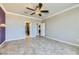 Spacious bedroom with ceiling fan and access to bathroom at 4750 Fiore Bella Blvd, Las Vegas, NV 89135
