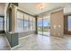 Bright breakfast nook with sliding door access to backyard and view at 4750 Fiore Bella Blvd, Las Vegas, NV 89135