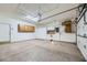 Garage with overhead storage and built-in cabinets at 4750 Fiore Bella Blvd, Las Vegas, NV 89135