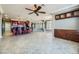 Kitchen with dark wood cabinets, granite counters, and an island with seating at 4750 Fiore Bella Blvd, Las Vegas, NV 89135