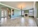 Open living room with fireplace and high ceilings at 4750 Fiore Bella Blvd, Las Vegas, NV 89135