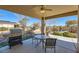 Covered patio with built-in grill and seating area at 4750 Fiore Bella Blvd, Las Vegas, NV 89135