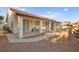 Covered patio with seating area and gravel yard at 5009 Elm Grove Dr, Las Vegas, NV 89130