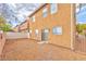 The backyard featuring low maintenance gravel and stucco walls at 5555 Sun Temple Ave, Las Vegas, NV 89139