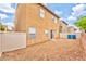 The backyard features low maintenance gravel with a block wall fence at 5555 Sun Temple Ave, Las Vegas, NV 89139