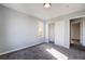 Bright bedroom with carpet, large closet, and access to another room at 5555 Sun Temple Ave, Las Vegas, NV 89139