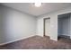 Spacious bedroom with carpet, closet, and access to another room at 5555 Sun Temple Ave, Las Vegas, NV 89139