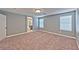 Gray-walled bedroom with carpet and an ensuite bathroom at 5555 Sun Temple Ave, Las Vegas, NV 89139