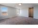 Spacious bedroom with neutral walls and carpet, offering ample natural light at 5555 Sun Temple Ave, Las Vegas, NV 89139