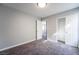 Bright bedroom with carpet, closet, and access to hallway and loft at 5555 Sun Temple Ave, Las Vegas, NV 89139