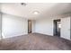Large bedroom with carpet and access to another room at 5555 Sun Temple Ave, Las Vegas, NV 89139