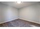 Simple bedroom with carpet flooring and neutral wall colors at 5555 Sun Temple Ave, Las Vegas, NV 89139