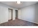 Bright bedroom with carpet, closet, and access to hallway and bathroom at 5555 Sun Temple Ave, Las Vegas, NV 89139