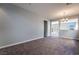 Bright dining room with gray walls, carpet, and open floor plan at 5555 Sun Temple Ave, Las Vegas, NV 89139