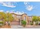 Inviting two-story home boasting desert landscaping, a two-car garage, and a charming entry at 5555 Sun Temple Ave, Las Vegas, NV 89139