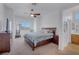 Spacious main bedroom with a large bed, dresser, and ceiling fan at 5831 Flight Wing St, Las Vegas, NV 89113