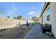 Landscaped backyard with fire pit and seating area at 6318 Amber Sunrise St, North Las Vegas, NV 89031