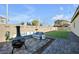 Relaxing backyard oasis with fire pit and seating area at 6318 Amber Sunrise St, North Las Vegas, NV 89031