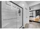 Clean bathroom with a walk-in shower and view into bedroom at 6318 Amber Sunrise St, North Las Vegas, NV 89031