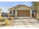 Charming single-story home with a well-maintained front yard and neutral color palette at 6318 Amber Sunrise St, North Las Vegas, NV 89031