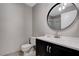 Clean bathroom with updated vanity and a large mirror at 6657 W Tropicana Ave # 201, Las Vegas, NV 89103