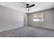 Spacious bedroom with ceiling fan and access to bathroom at 6657 W Tropicana Ave # 201, Las Vegas, NV 89103
