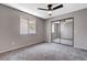 Bright bedroom featuring mirrored closet doors and ceiling fan at 6657 W Tropicana Ave # 201, Las Vegas, NV 89103