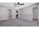 Main bedroom with carpet, ceiling fan and access to bathroom at 6657 W Tropicana Ave # 201, Las Vegas, NV 89103