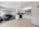 Open concept kitchen with white cabinets and view into living room at 6657 W Tropicana Ave # 201, Las Vegas, NV 89103