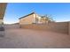 Large backyard with block wall and string lights at 6955 Sunrise Crest Dr, Las Vegas, NV 89142