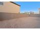 Large backyard with block wall and string lights at 6955 Sunrise Crest Dr, Las Vegas, NV 89142