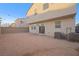 Large backyard with block wall and string lights at 6955 Sunrise Crest Dr, Las Vegas, NV 89142