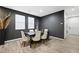 Elegant dining room with dark wood table and neutral chairs at 6955 Sunrise Crest Dr, Las Vegas, NV 89142