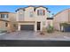 Two-story house with a dark brown garage door and landscaping at 6955 Sunrise Crest Dr, Las Vegas, NV 89142